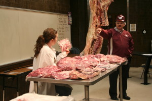 Clay Eastwood and Davey Griffin showing beef cuts