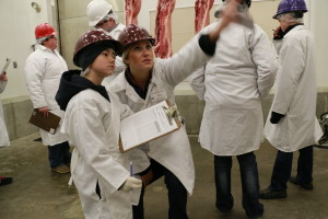 Sara Arsenault teaching pork carcass judging