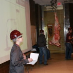 Emery Kunze discussing lamb carcasses
