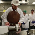 Wes Osburn stuffing bratwurst