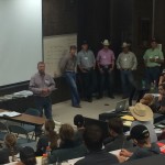 Past participants discussing segments of commercial steer contests